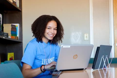 Reading Mentor at her laptop.